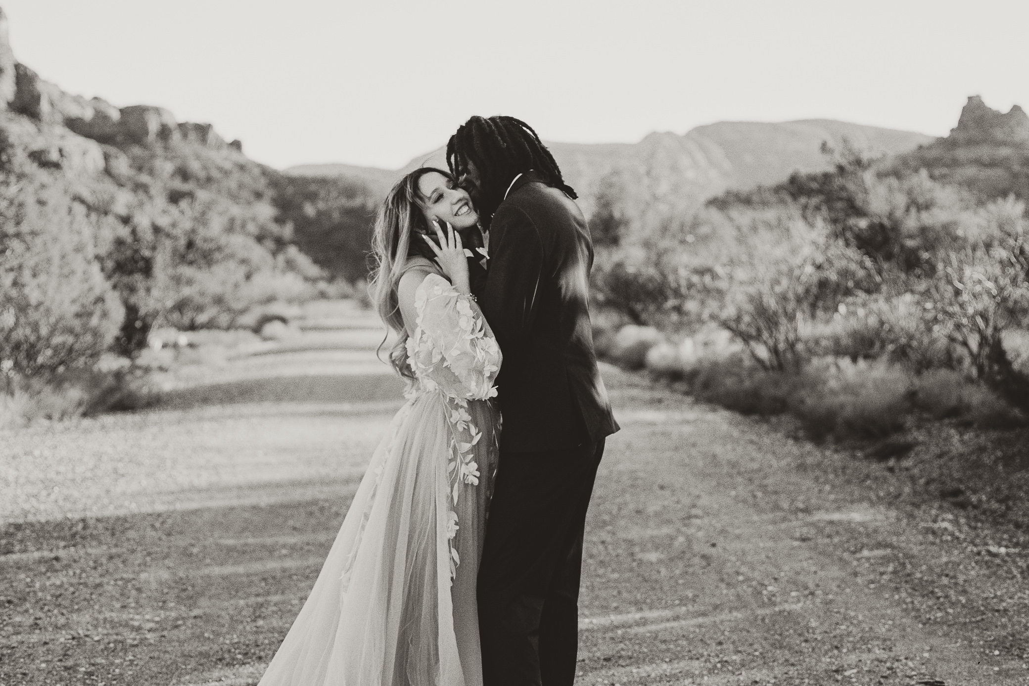 Film photo of an elopement couple on a road in Sedona, Arizona.